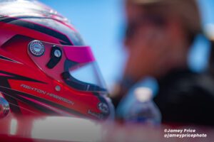 Auto Racing | Race car driver with helmet on